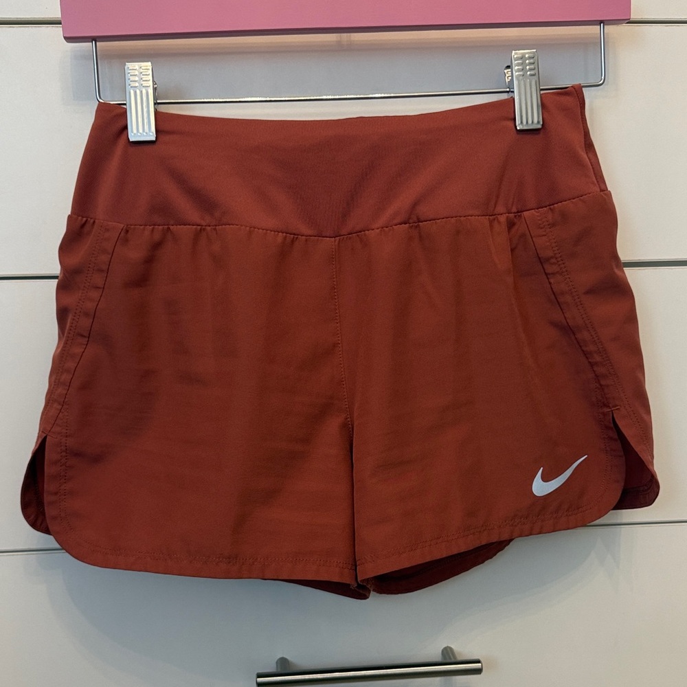 Nike dri fit Women's Athletic Shorts in Rust burnt orange color